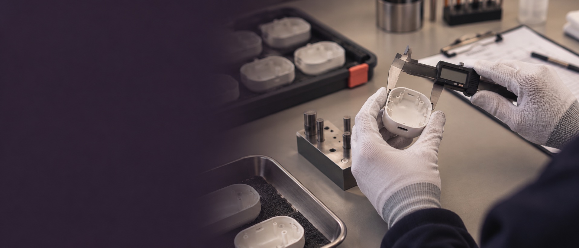 Contextual quality inspection scene with a handheld device housing and caliper